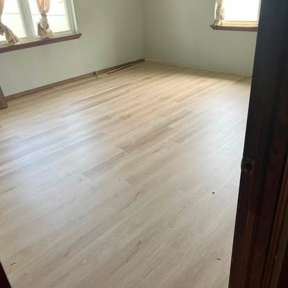 New flooring laid, trimmed, and flat