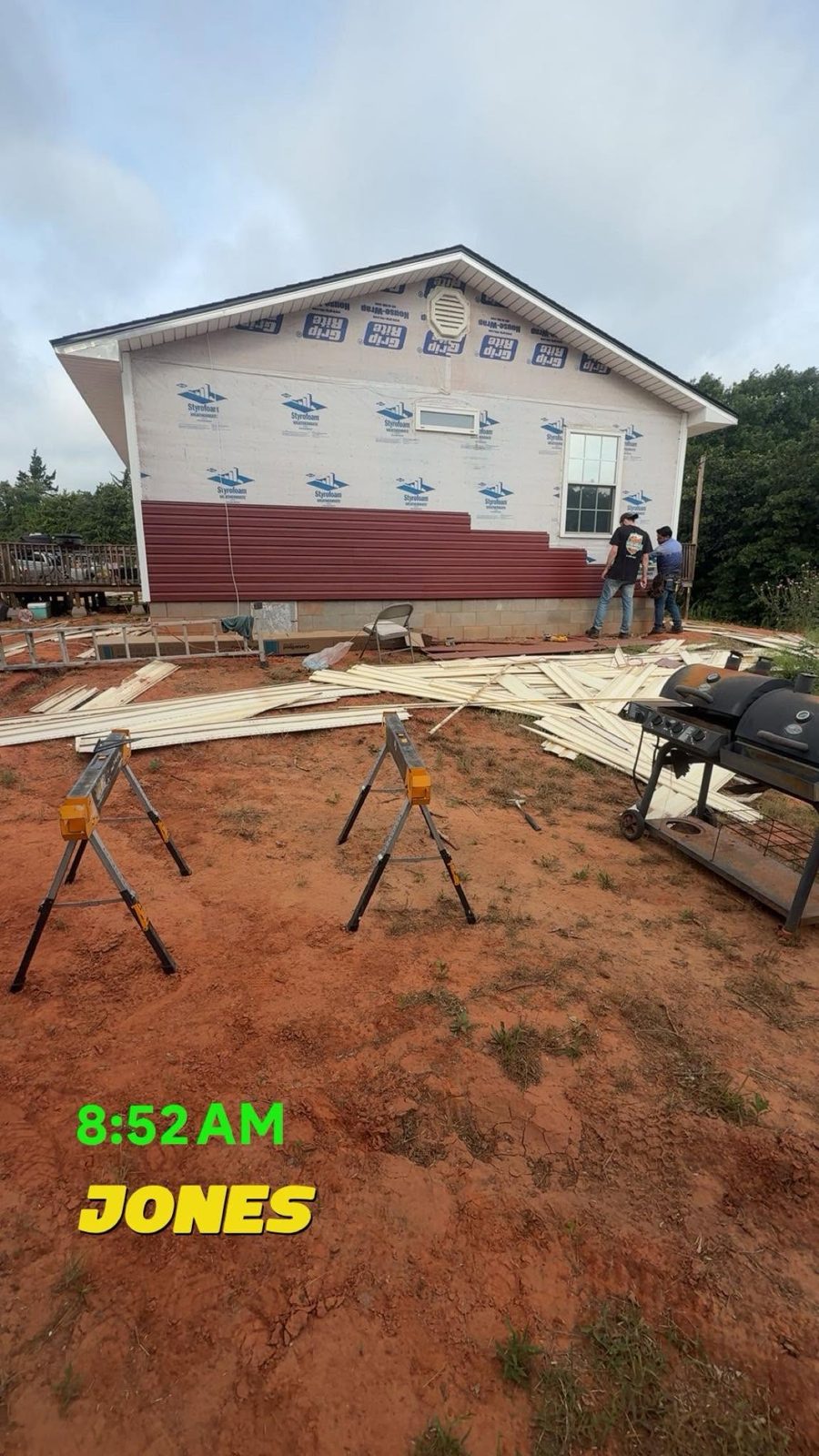 Siding going up over house wrap on a rural home in Jones, OK