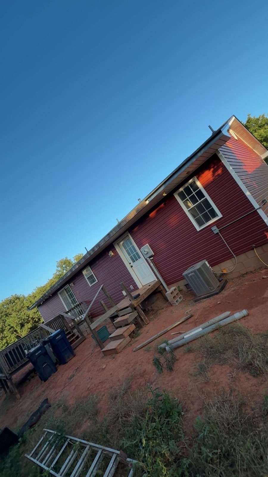 Home with new red siding, central Oklahoma